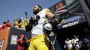 Pittsburgh Steelers offensive tackle and former Army Ranger Alejandro Villanueva (78) stands outside the tunnel alone during the national anthem before an NFL football game against the Chicago Bears, Sunday, in Chicago. (AP Photo/Nam Y. Huh)